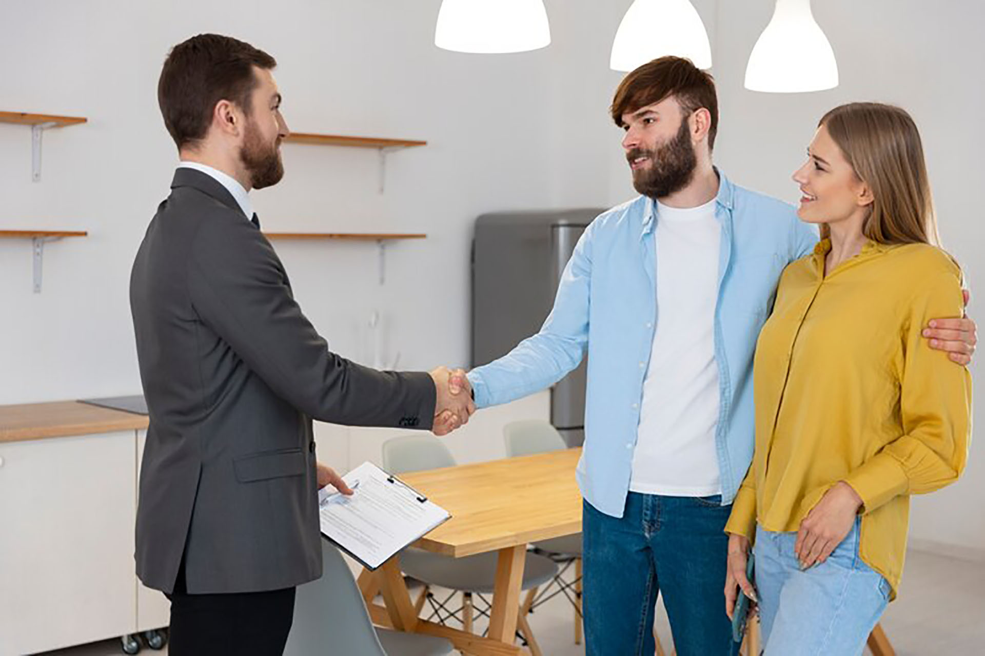 male-real-estate-agent-doing-business-showing-house-potential-buying-couple_23-2150164696